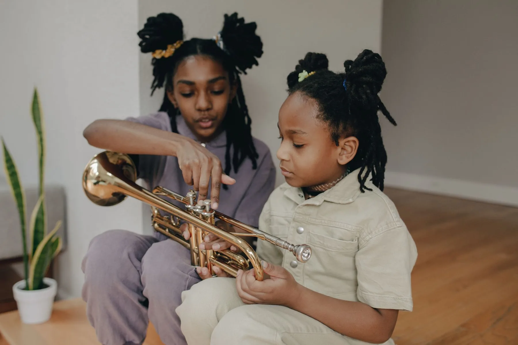 Children learning to play the trumpet Children learning to play the trumpet
