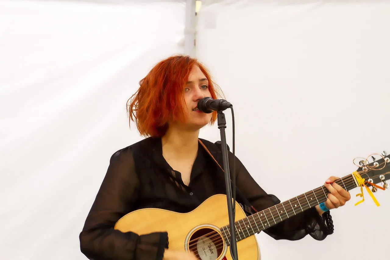 Folk singer with an acoustic guitar