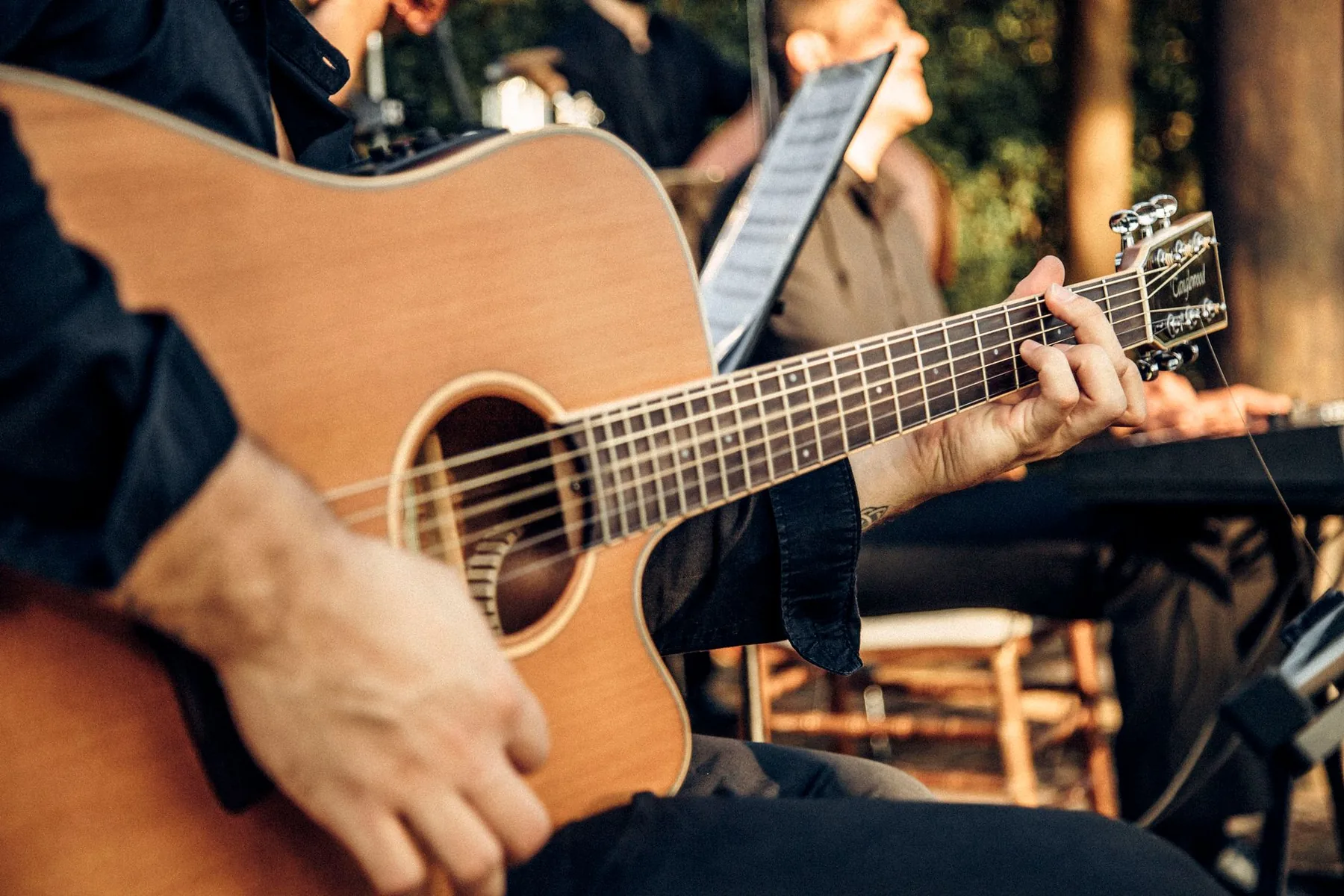 Acoustic guitarist in a folk session Acoustic guitarist in a folk session