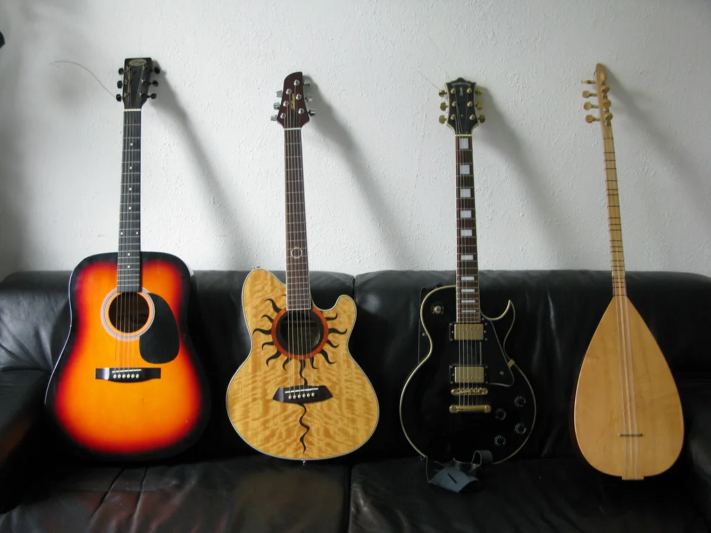 Collection of guitars and a folk instrument Collection of guitars and a folk instrument