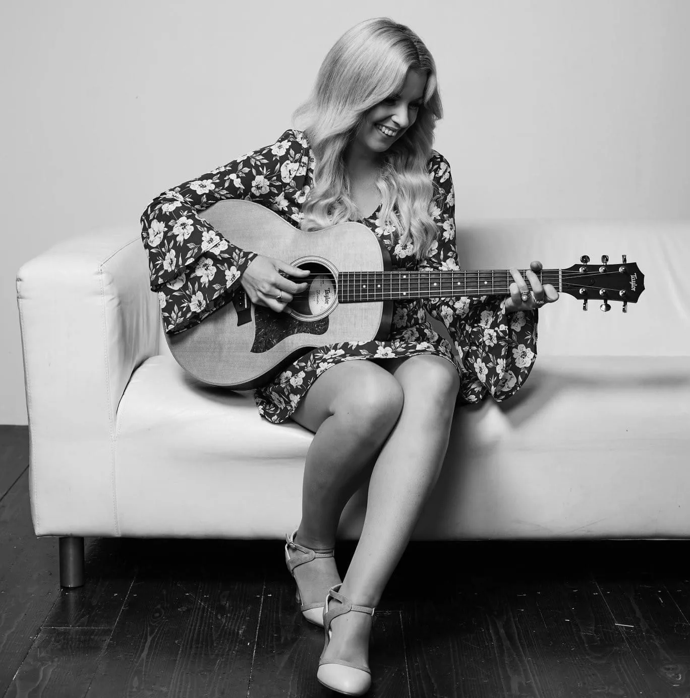 Female singer-songwriter playing guitar Female singer-songwriter playing guitar