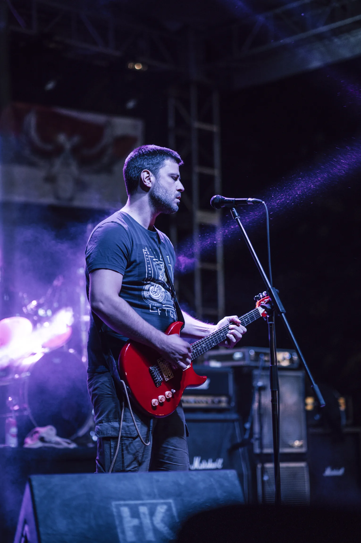 Guitarist performing on stage Guitarist performing on stage