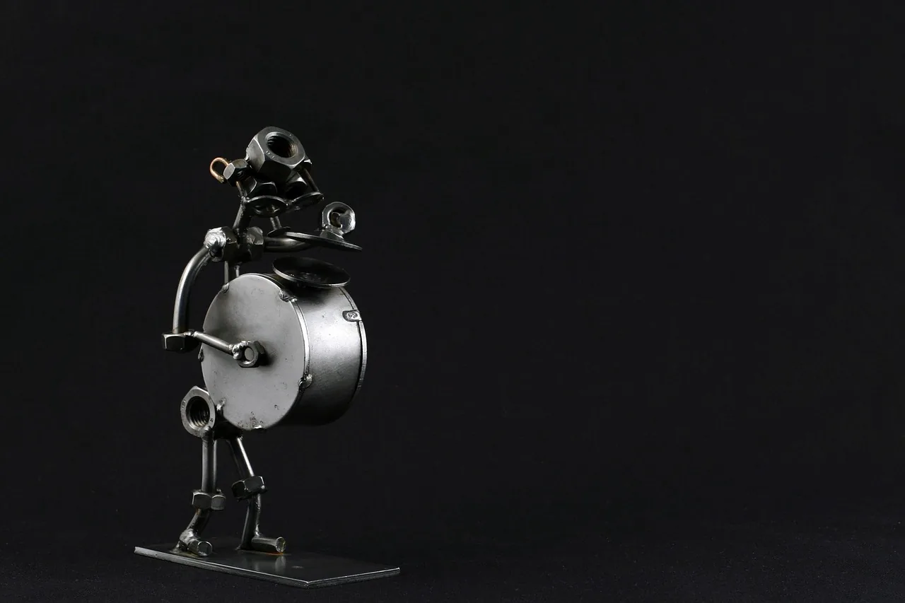 Metal sculpture of a drummer musician Metal sculpture of a drummer musician